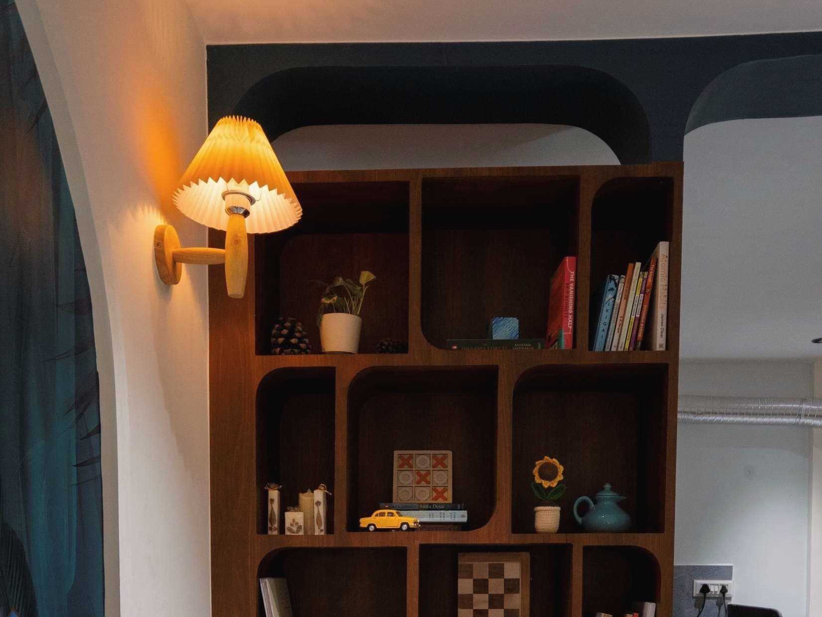 Bookshelf partition and warm lighting, BBQ Miles Café, Dhanori, Pune